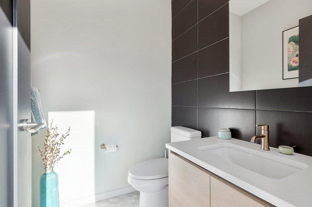 100 A Street, Unit 6 Boston, MA 02127 - Photo 14 of 37 a bathroom with a sink and a toilet