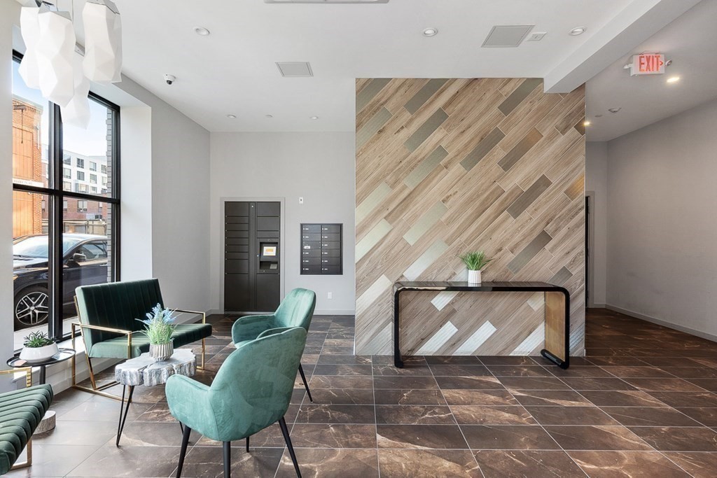 100 A Street, Unit 6 Boston, MA 02127 - Photo 34 of 37 a living room with furniture and a fireplace