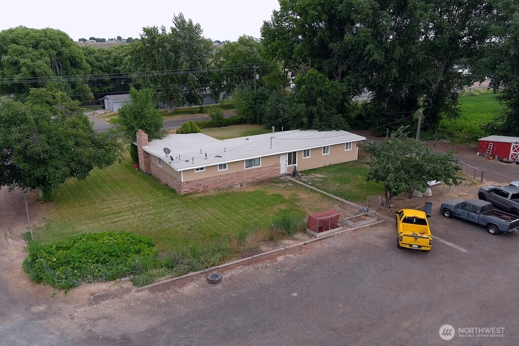 5788 Rd K Northeast Moses Lake, WA 98837 - Photo 3 of 40 an aerial view of a house with garden space and street view