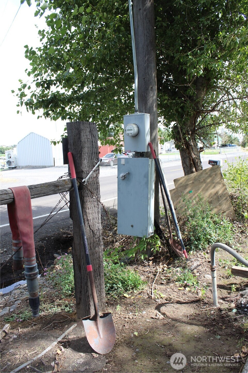 5788 Rd K Northeast Moses Lake, WA 98837 - Photo 32 of 40 a view of a house with a yard and a tree