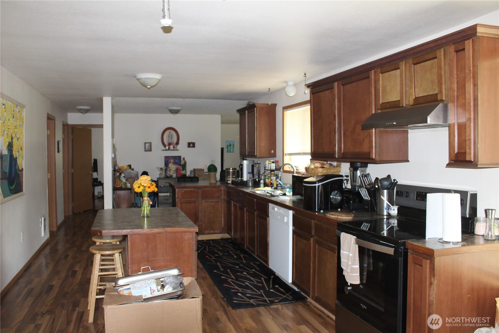 5788 Rd K Northeast Moses Lake, WA 98837 - Photo 35 of 40 a kitchen with sink a stove and cabinets