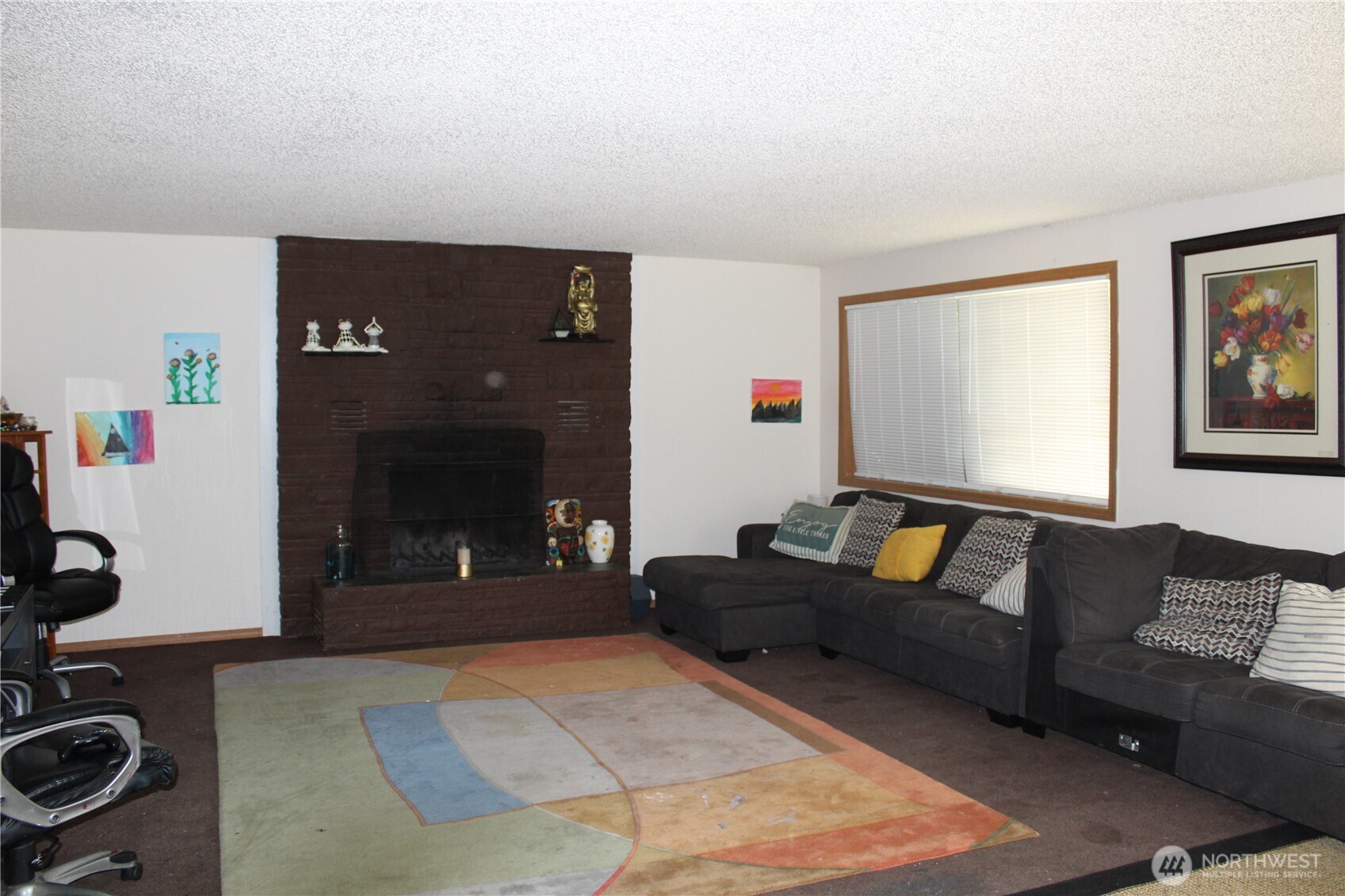 5788 Rd K Northeast Moses Lake, WA 98837 - Photo 36 of 40 a living room with furniture and a fireplace