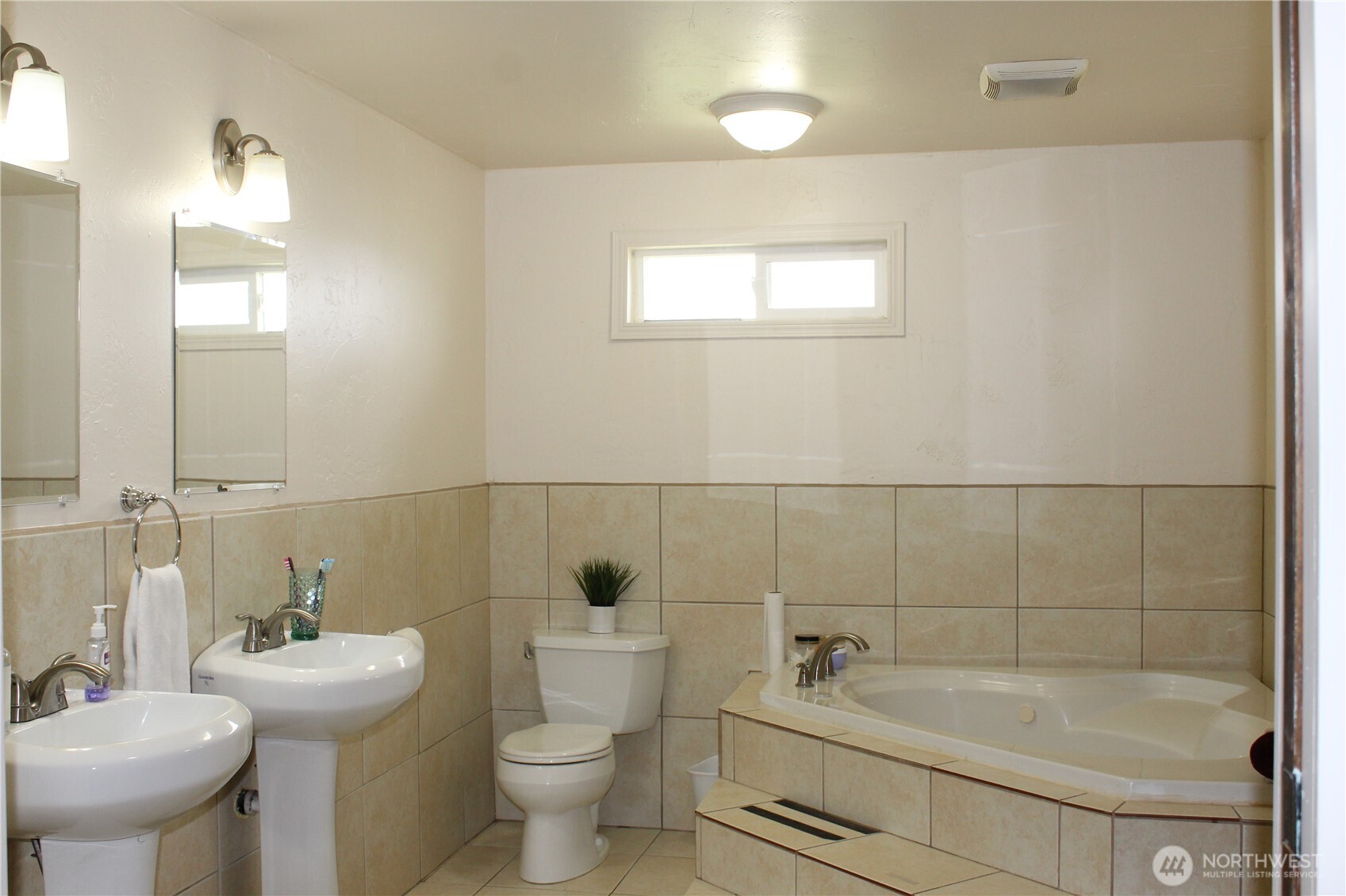 5788 Rd K Northeast Moses Lake, WA 98837 - Photo 39 of 40 a bathroom with a sink a toilet and shower