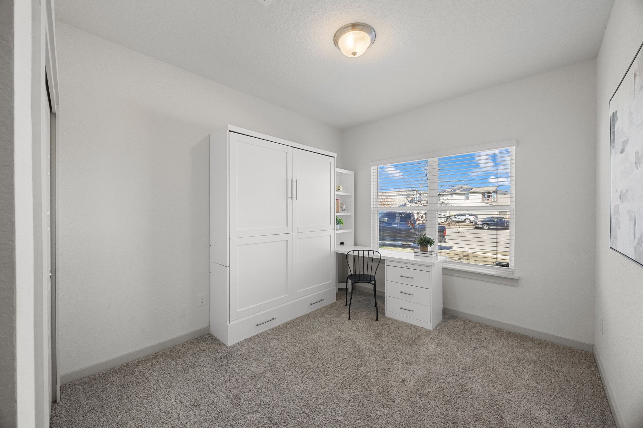 100 Deserti Road Leander, TX 78641 - Photo 20 of 27 a kitchen with a refrigerator and white cabinets