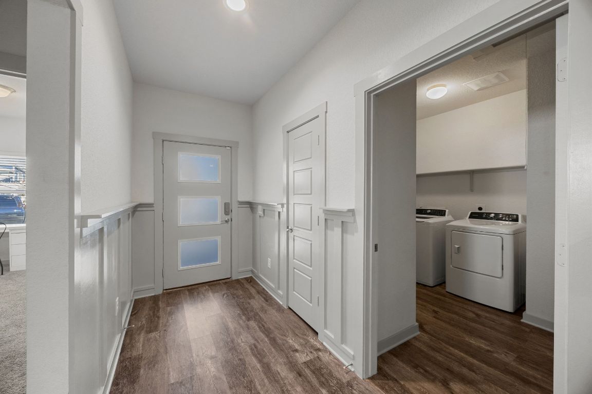 100 Deserti Road Leander, TX 78641 - Photo 3 of 27 Entryway with wainscoted decorative wall leading to the coat's closet, 2 bedrooms on the right side and the Laundry room on the left side.