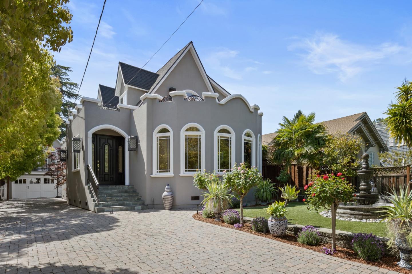 a front view of a house with garden