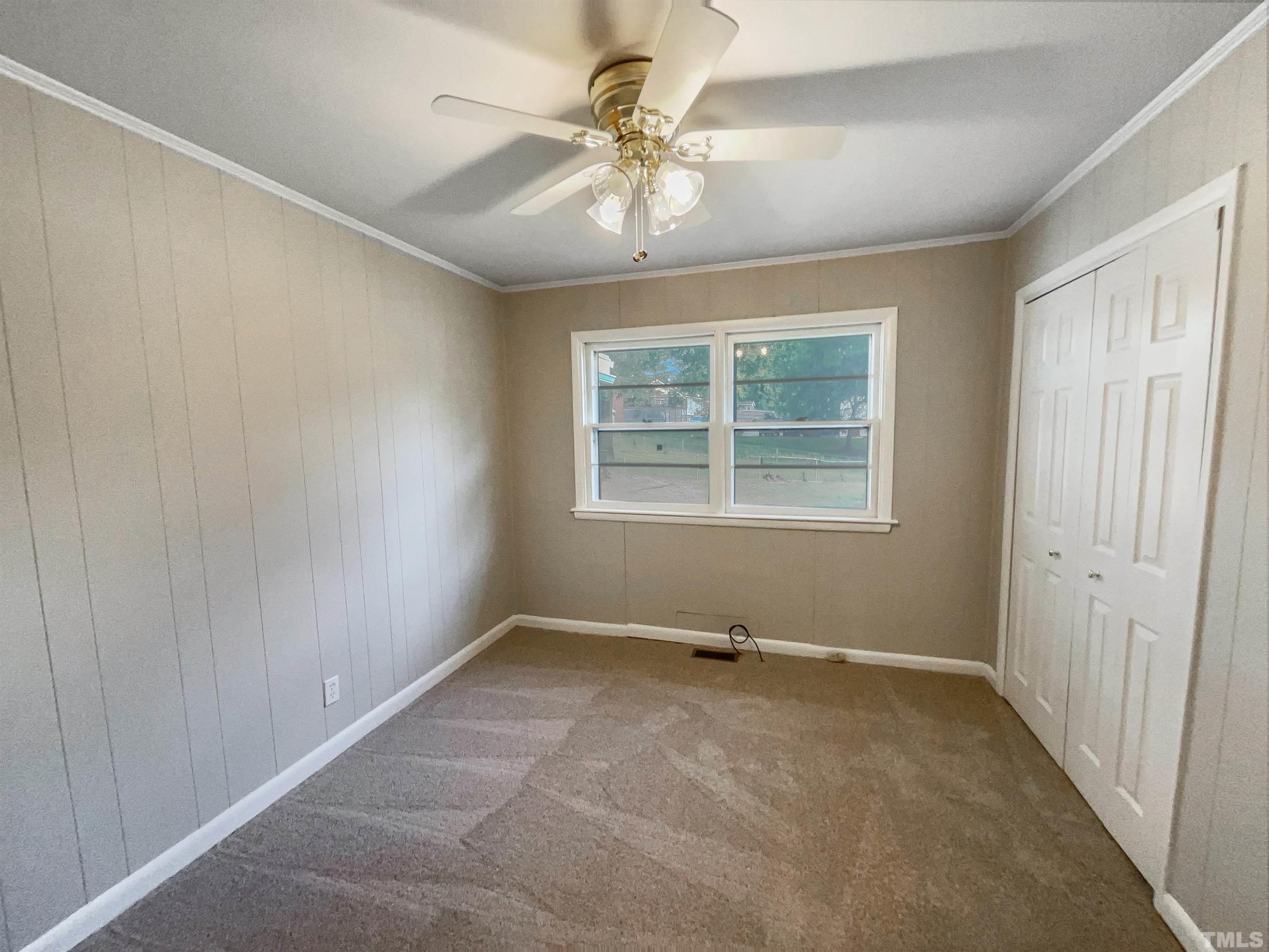 2905 Bardwell Road Raleigh, NC 27604 - Photo 17 of 17 an empty room with windows and fan