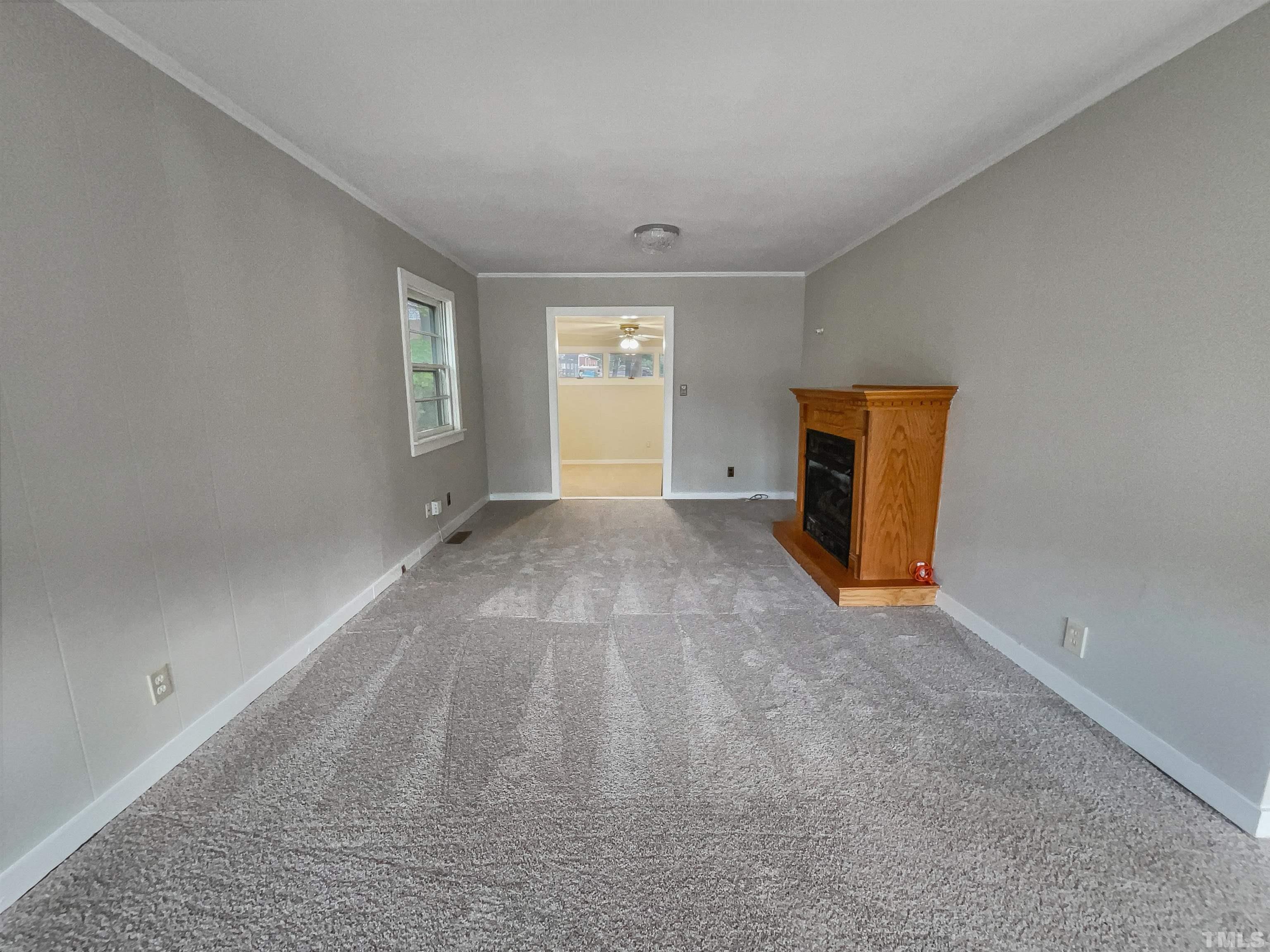 2905 Bardwell Road Raleigh, NC 27604 - Photo 5 of 17 wooden floor in an empty room with a window