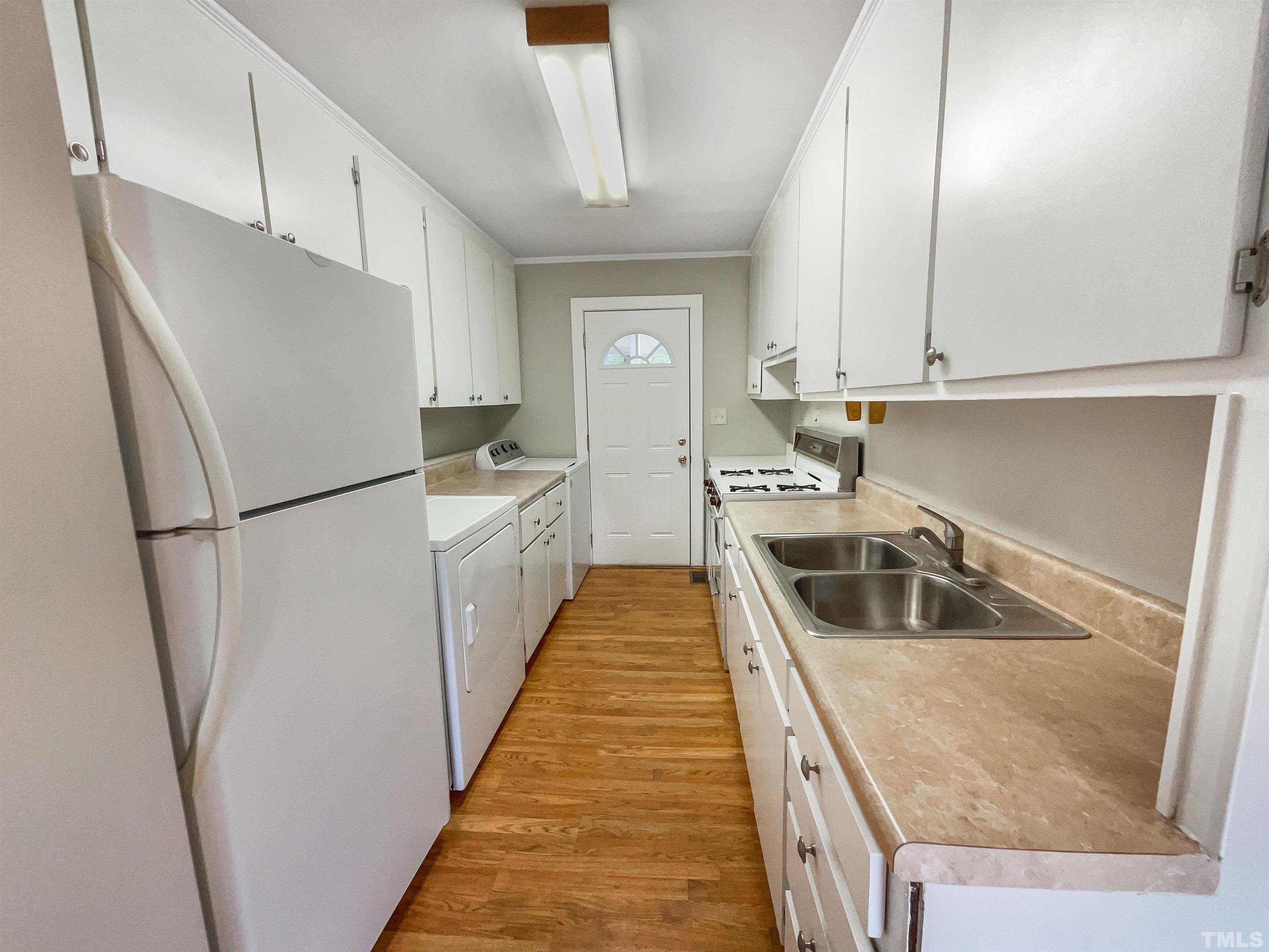 2905 Bardwell Road Raleigh, NC 27604 - Photo 9 of 17 a kitchen with white cabinets and white appliances