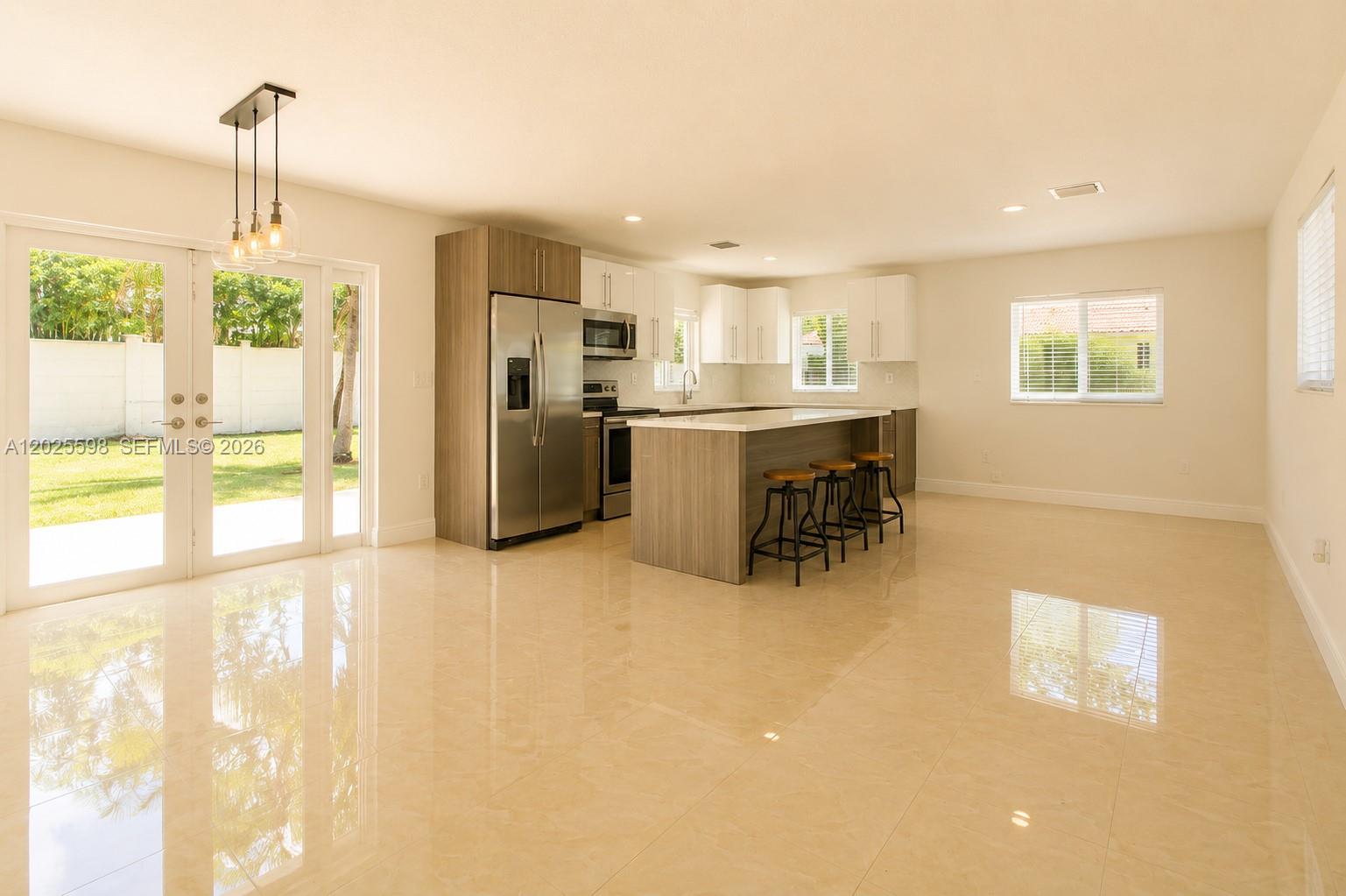 9421 Southwest 150th Street Miami, FL 33176 - Photo 13 of 31 a view of a kitchen with furniture and a window