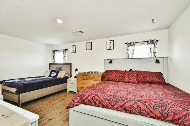 a bathroom with a sink mirror toilet and vanity