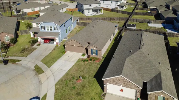 an aerial view of residential houses with outdoor space
