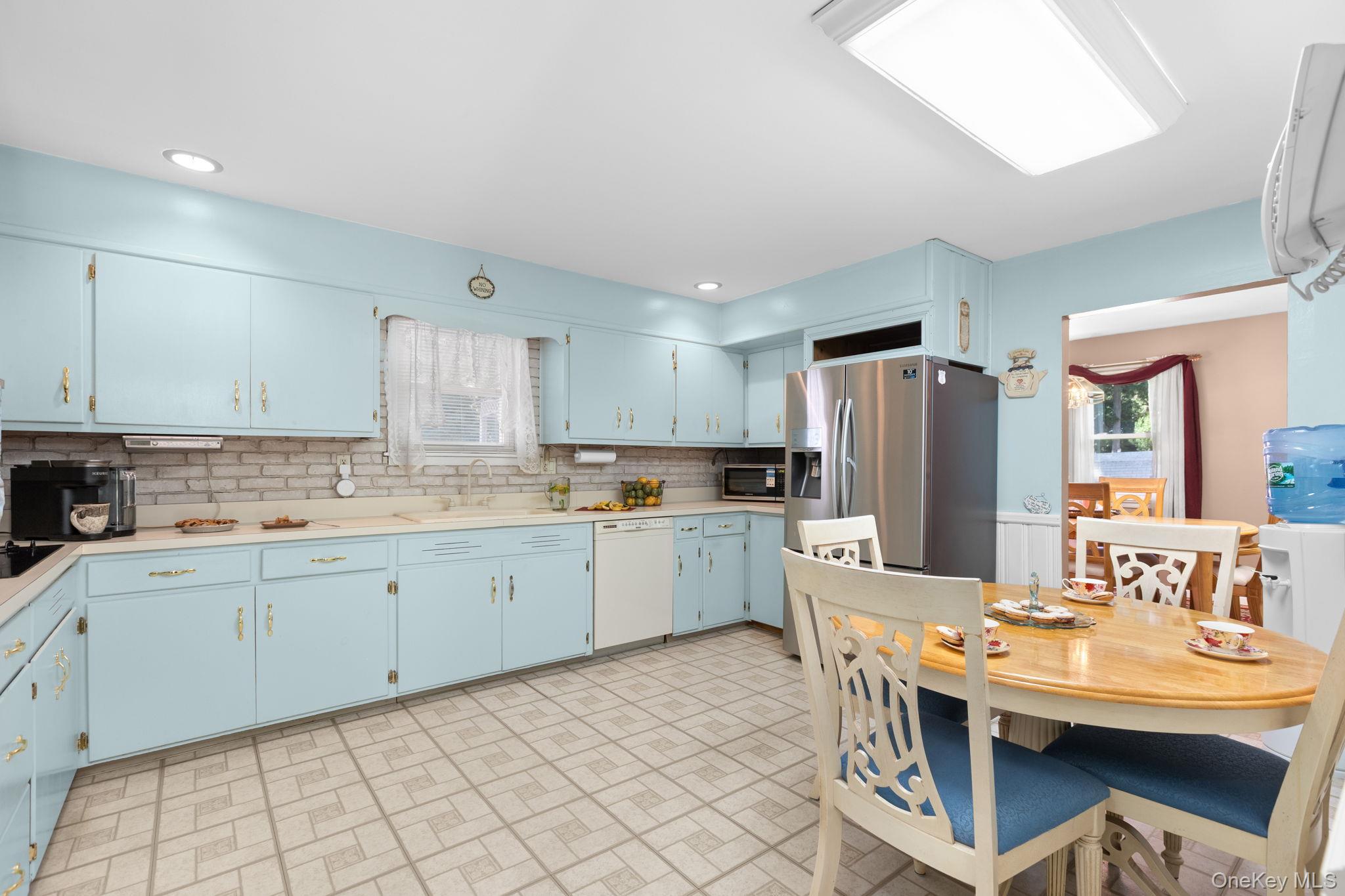 25 Harmony Road Brewster, NY 10509 - Photo 12 of 42 Kitchen with an abundance of cabinets for easy storage, stainless steel appliances and breakfast nook.