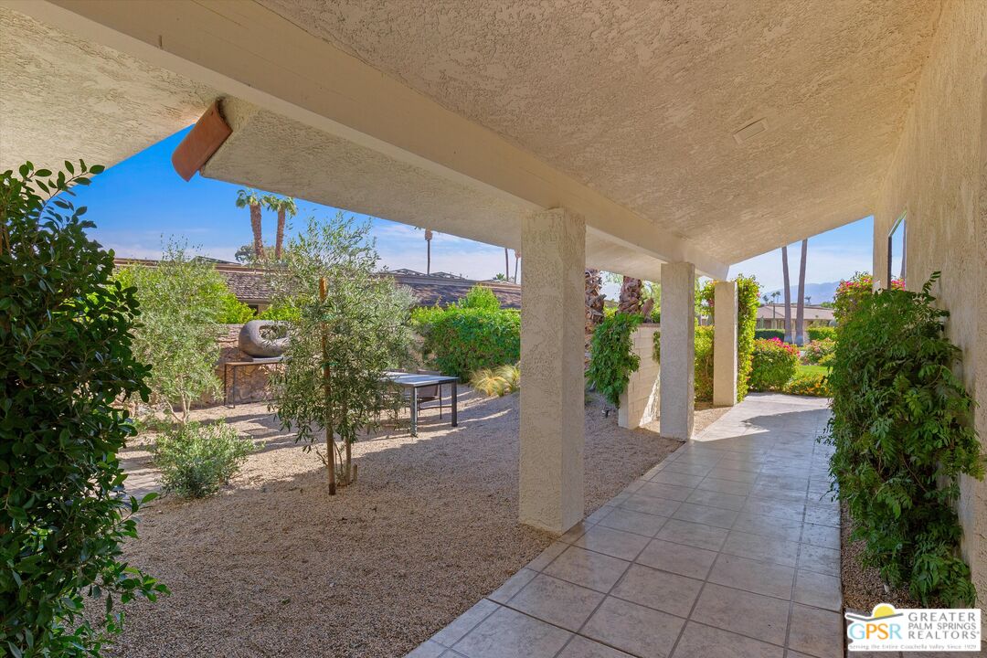6 Trojan Court Rancho Mirage, CA 92270 - Photo 11 of 51 a view of a porch with chairs and potted plants