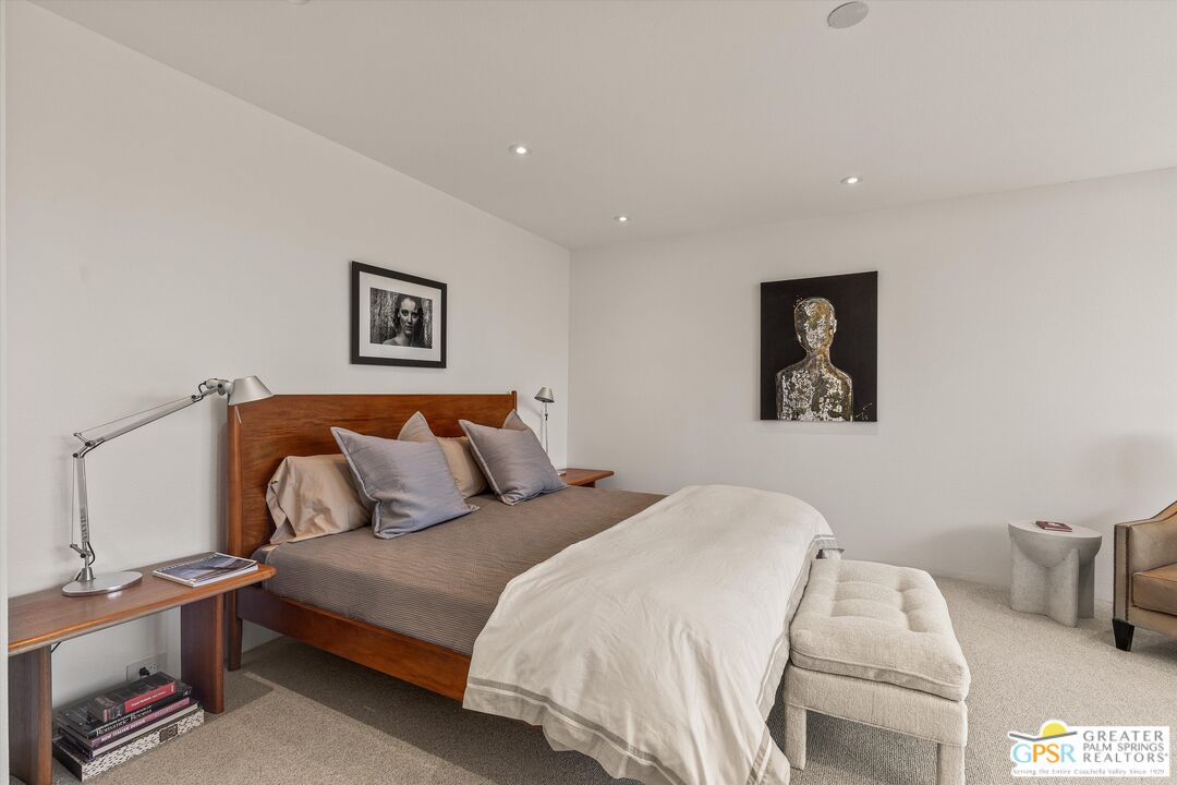 6 Trojan Court Rancho Mirage, CA 92270 - Photo 40 of 51 a bedroom with a bed and a couch