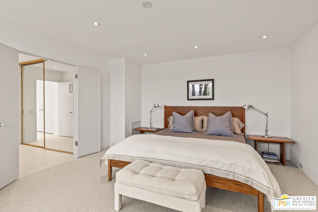 6 Trojan Court Rancho Mirage, CA 92270 - Photo 42 of 51 a bedroom with a bed and a lamp