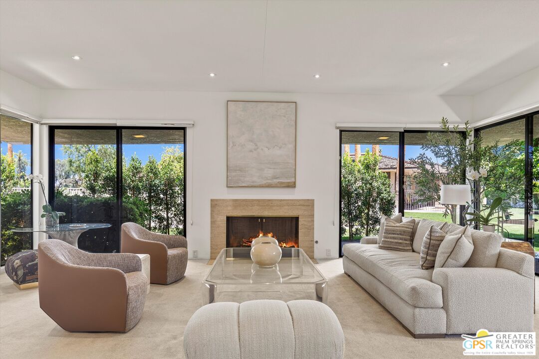 6 Trojan Court Rancho Mirage, CA 92270 - Photo 5 of 51 a living room with furniture and a fireplace