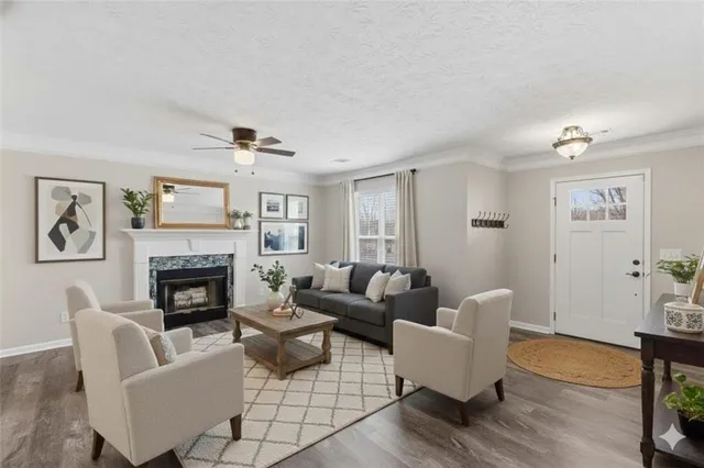 a kitchen with a refrigerator and white cabinets