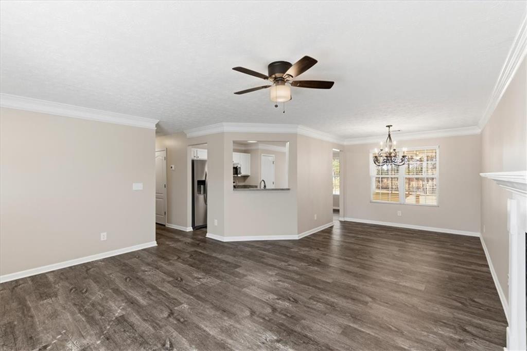 125 Governor Lane Temple, GA 30179 - Photo 17 of 57 a view of an empty room with window and wooden floor