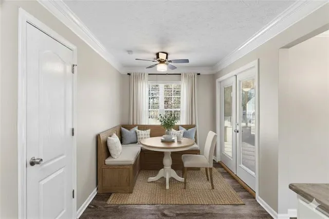 an empty room with a window and a ceiling fan