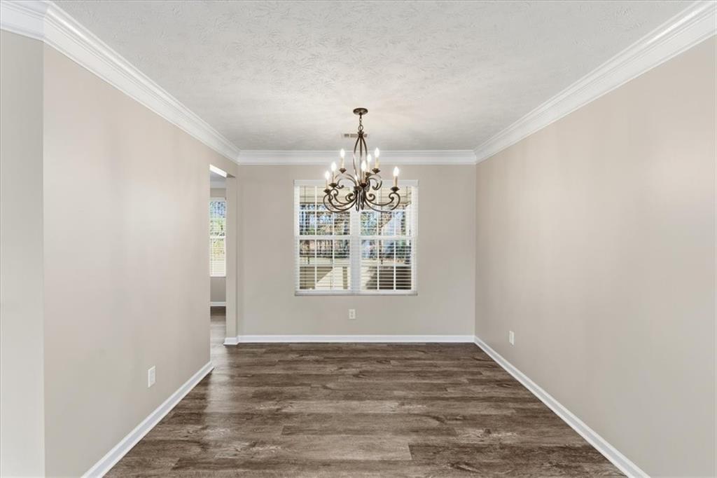 125 Governor Lane Temple, GA 30179 - Photo 25 of 57 a view of an empty room with wooden floor and a window