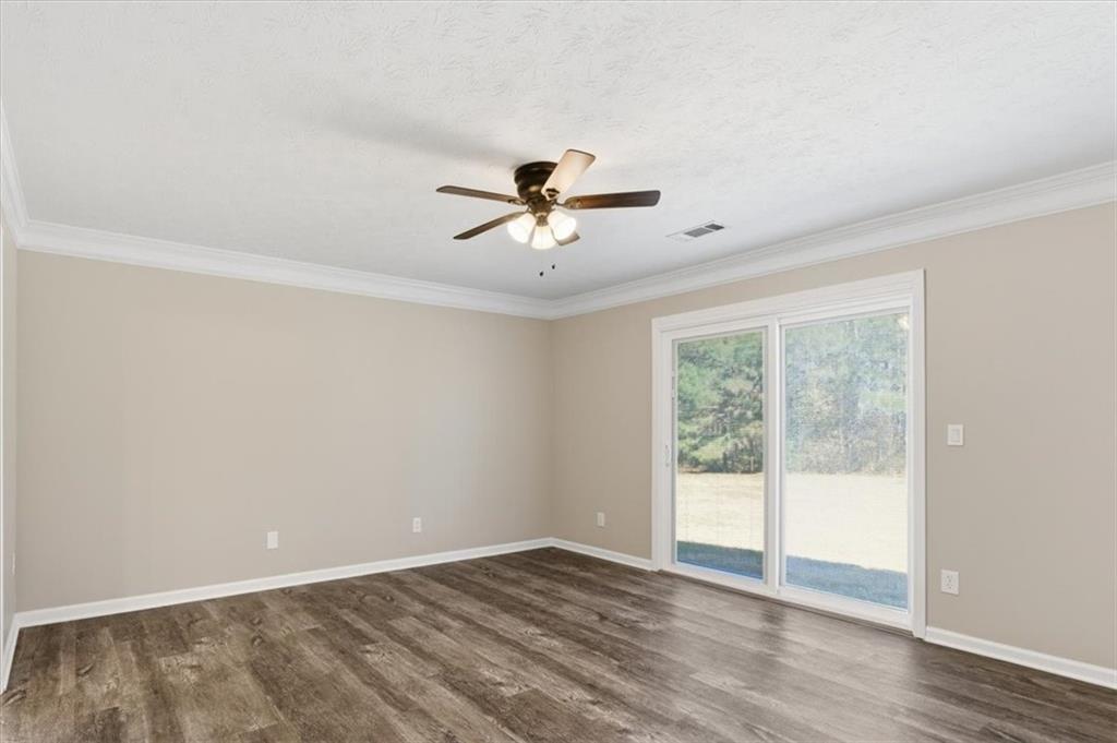 125 Governor Lane Temple, GA 30179 - Photo 28 of 57 wooden floor in an empty room with a window
