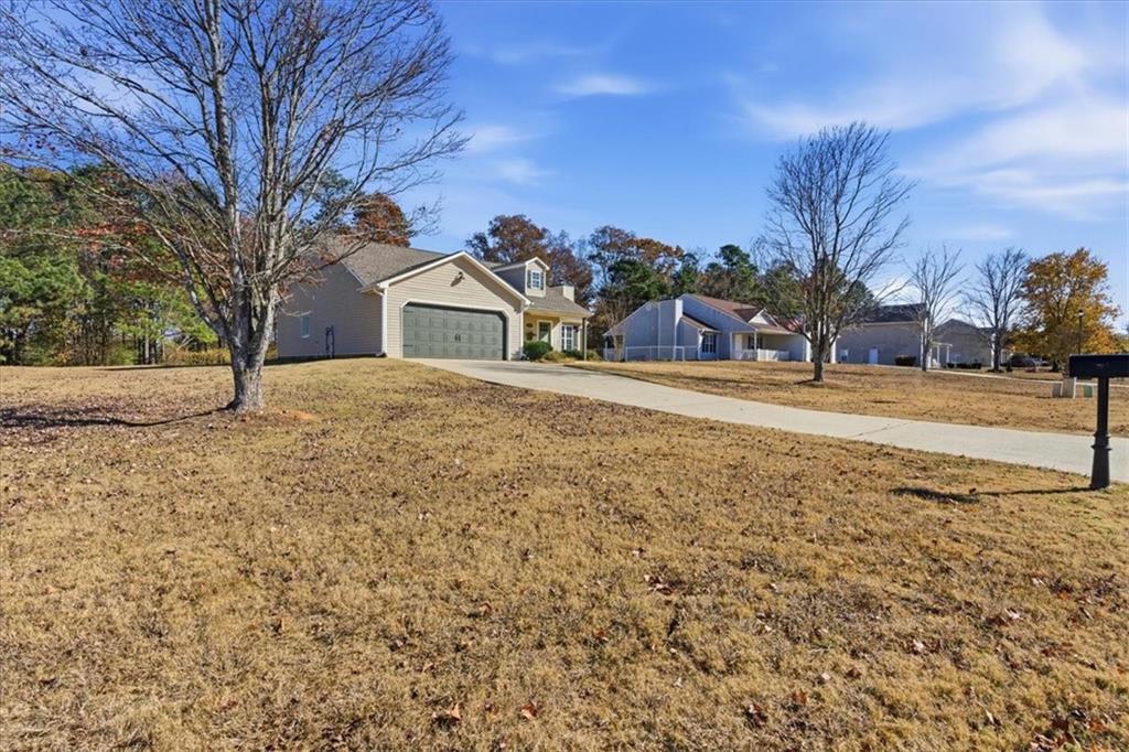 125 Governor Lane Temple, GA 30179 - Photo 5 of 57 a view of a house with a yard covered with snow