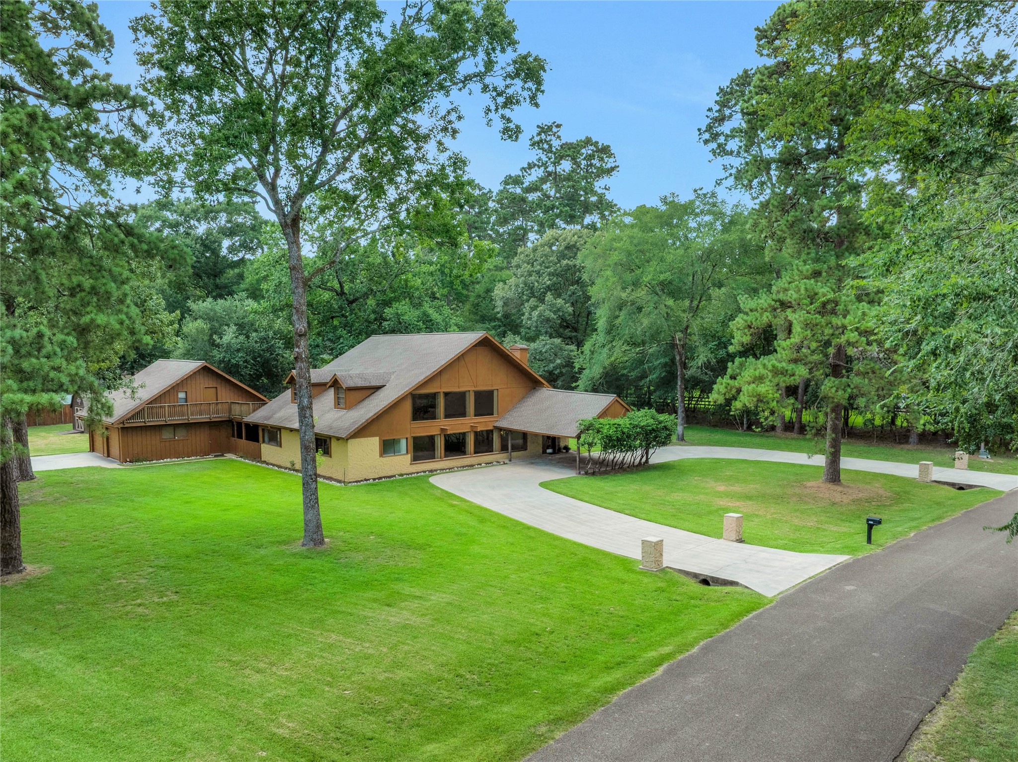 15418 Willis Way Conroe, TX 77384 - Photo 1 of 41 Rare property on 1.1 acres in the back corner of the neighborhood. The primary home is a 4 bedroom with 2.5 bathrooms. The garage has been finished out for two cars and a large workspace; it was used as living quarters while the main home was completed and is plumbed accordingly. Large storage space above the garage.