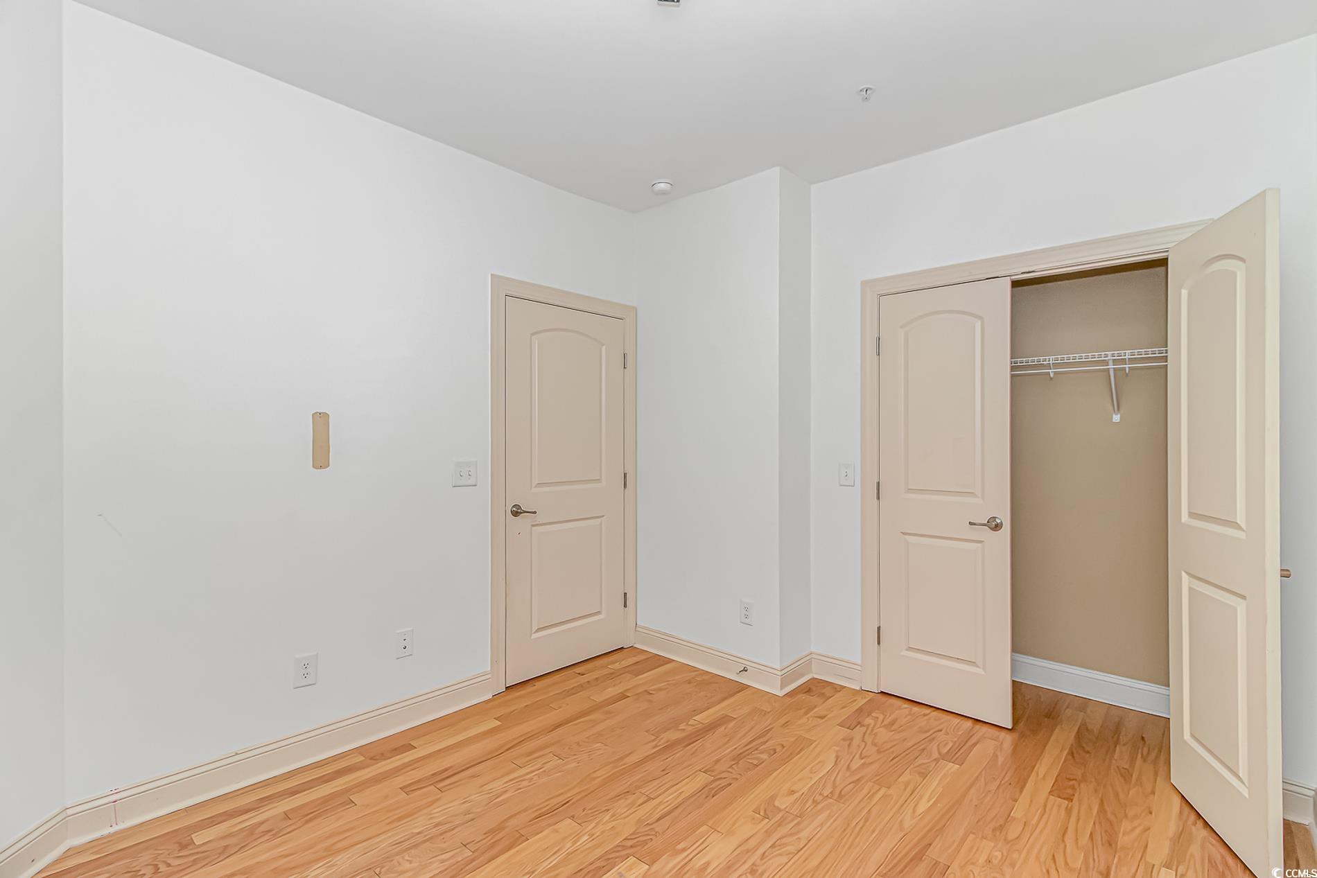 128 Puffin Drive, Unit 3A Pawleys Island, SC 29585 - Photo 13 of 30 bedroom with light wood finished floors and a closet