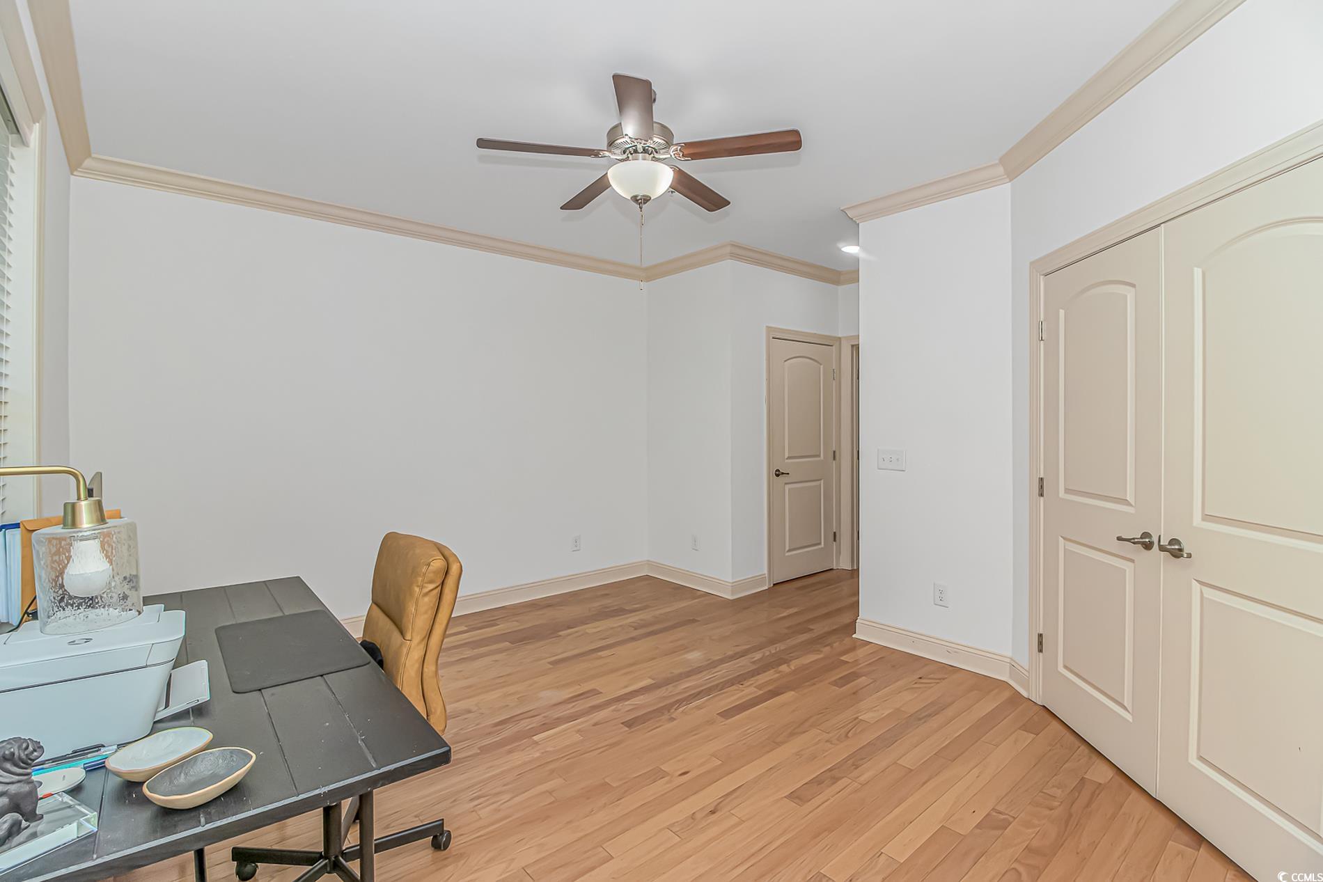 128 Puffin Drive, Unit 3A Pawleys Island, SC 29585 - Photo 22 of 30 Home office with ornamental molding, light wood-style floors, and a ceiling fan
