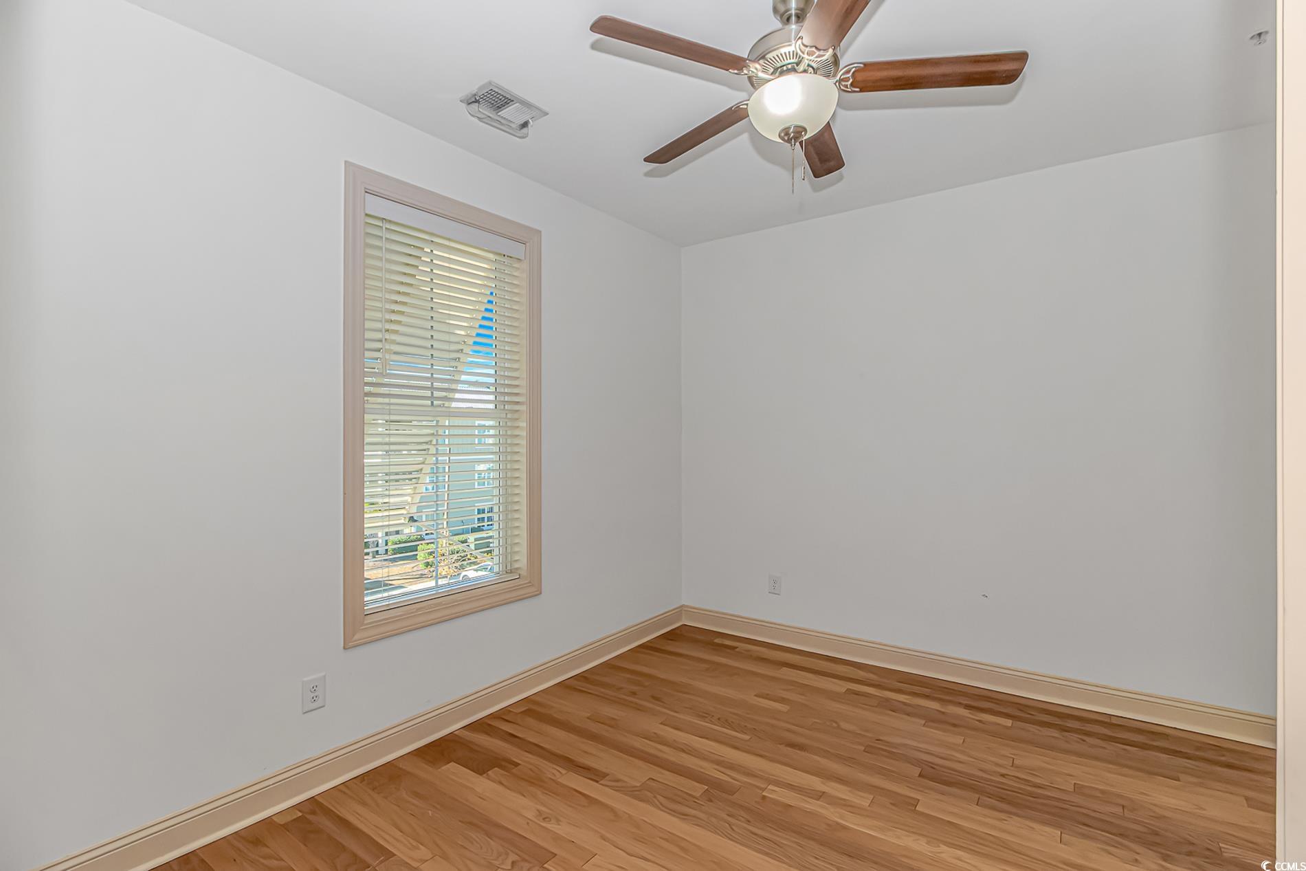128 Puffin Drive, Unit 3A Pawleys Island, SC 29585 - Photo 9 of 30 room featuring light wood-style flooring and ceiling fan