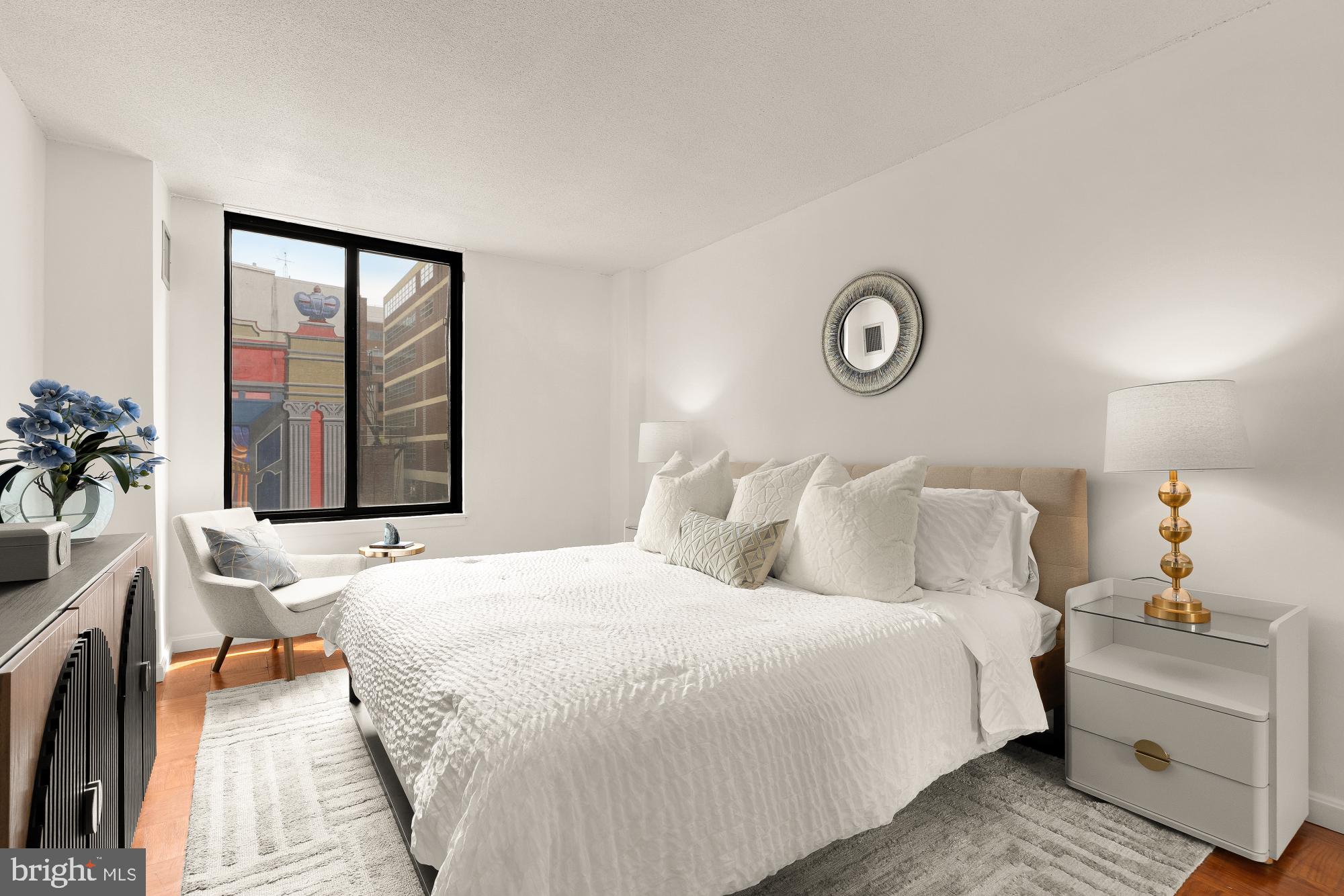 1301 20th Street Northwest, Unit 312 Washington, DC 20036 - Photo 18 of 31 a bedroom with a bed and a window