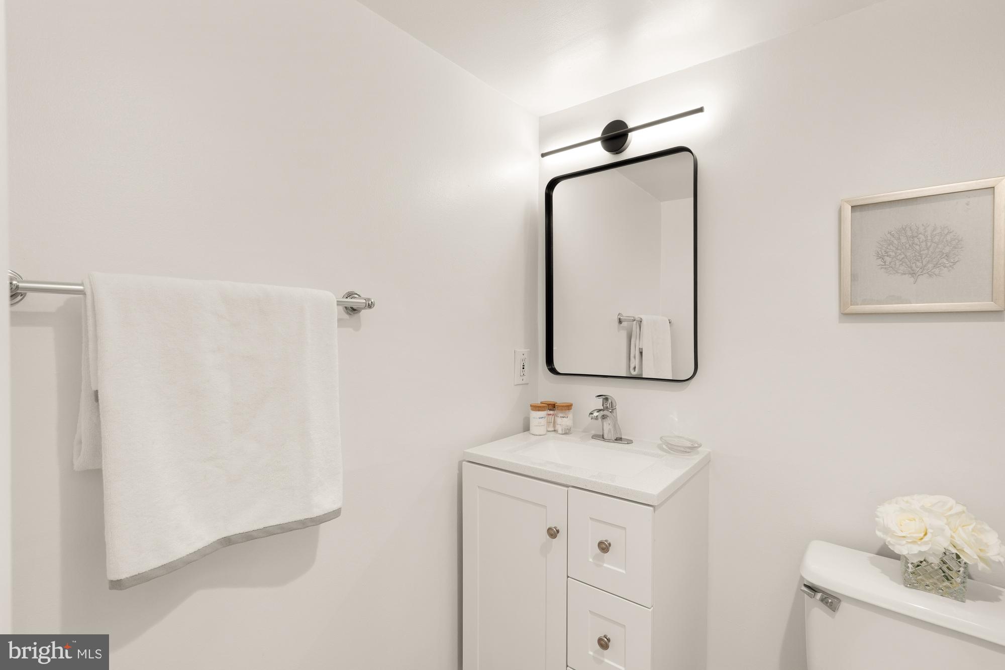 1301 20th Street Northwest, Unit 312 Washington, DC 20036 - Photo 21 of 31 a bathroom with a sink and a mirror