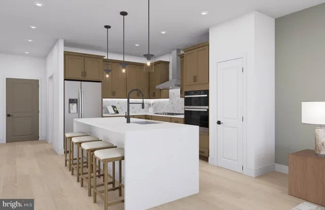 a kitchen with kitchen island a refrigerator a oven a stove and a kitchen island with wooden floor