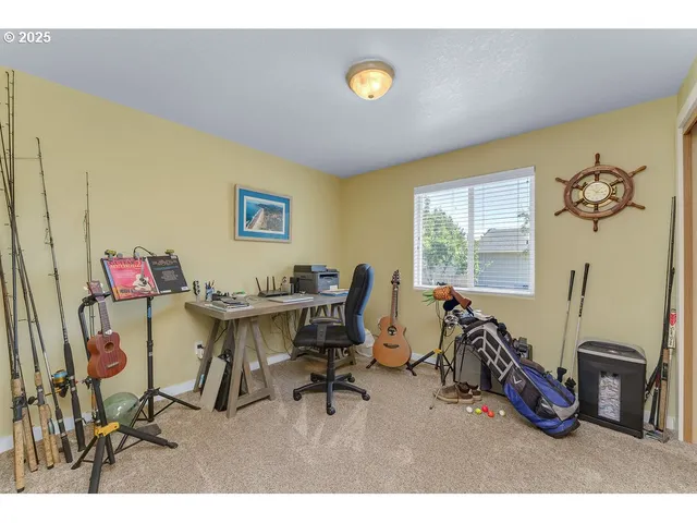 a view of a workspace with furniture