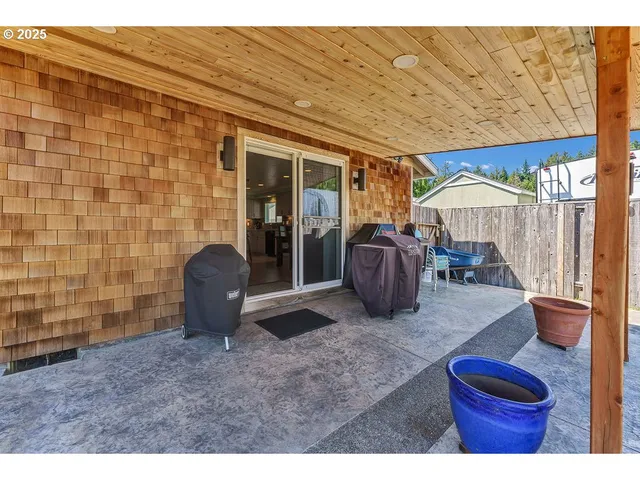 a room with furniture a flat screen tv and a fireplace