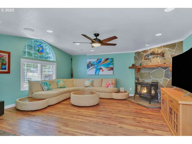 a living room with fireplace furniture and a flat screen tv