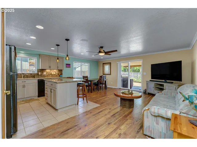 a open kitchen with sink cabinets and wooden floor