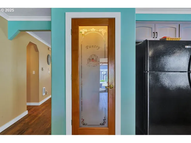 a bathroom with a glass door shower and a sink