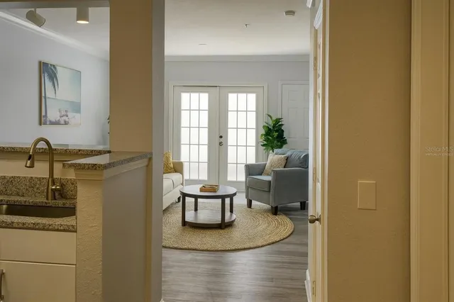 a dining room with furniture and a window