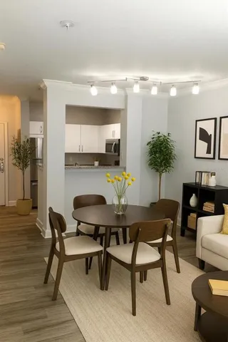 a dining room with furniture and window