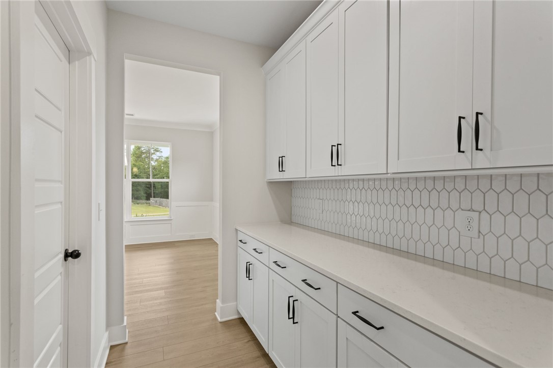 313 Old Shirley Road Central, SC 29630 - Photo 7 of 30 This bright kitchen features ample cabinet space, sleek countertops, and modern flooring.