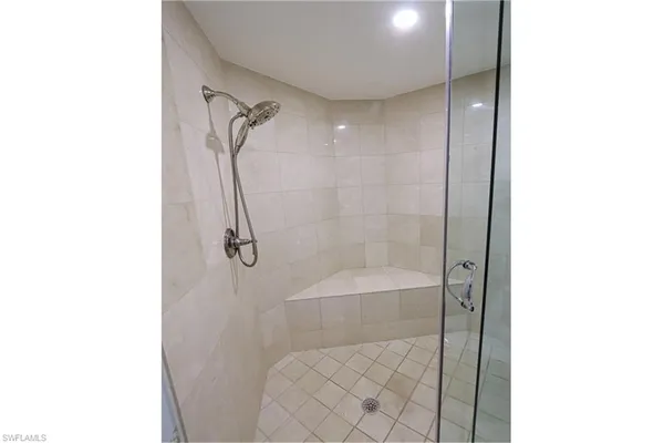a bathroom with a shower and a toilet