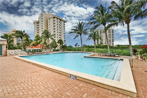 a view of a swimming pool and a yard