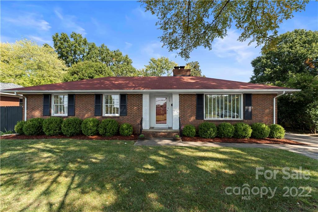 1705 Tyvola Road Charlotte, NC 28210 - Photo 1 of 40 a front view of a house with a yard