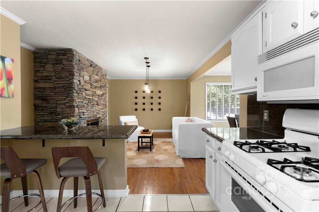 1705 Tyvola Road Charlotte, NC 28210 - Photo 15 of 40 a kitchen with a table and chairs
