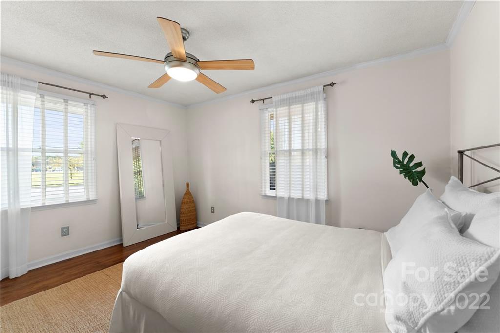 1705 Tyvola Road Charlotte, NC 28210 - Photo 18 of 40 a bedroom with a large bed and a window