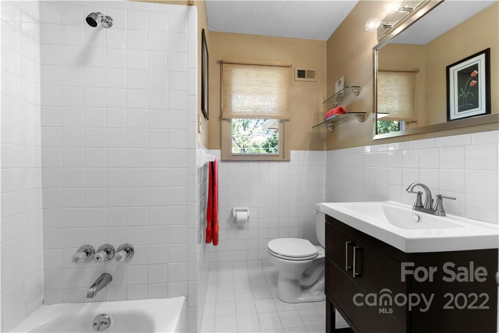 1705 Tyvola Road Charlotte, NC 28210 - Photo 20 of 40 a bathroom with a sink and a toilet