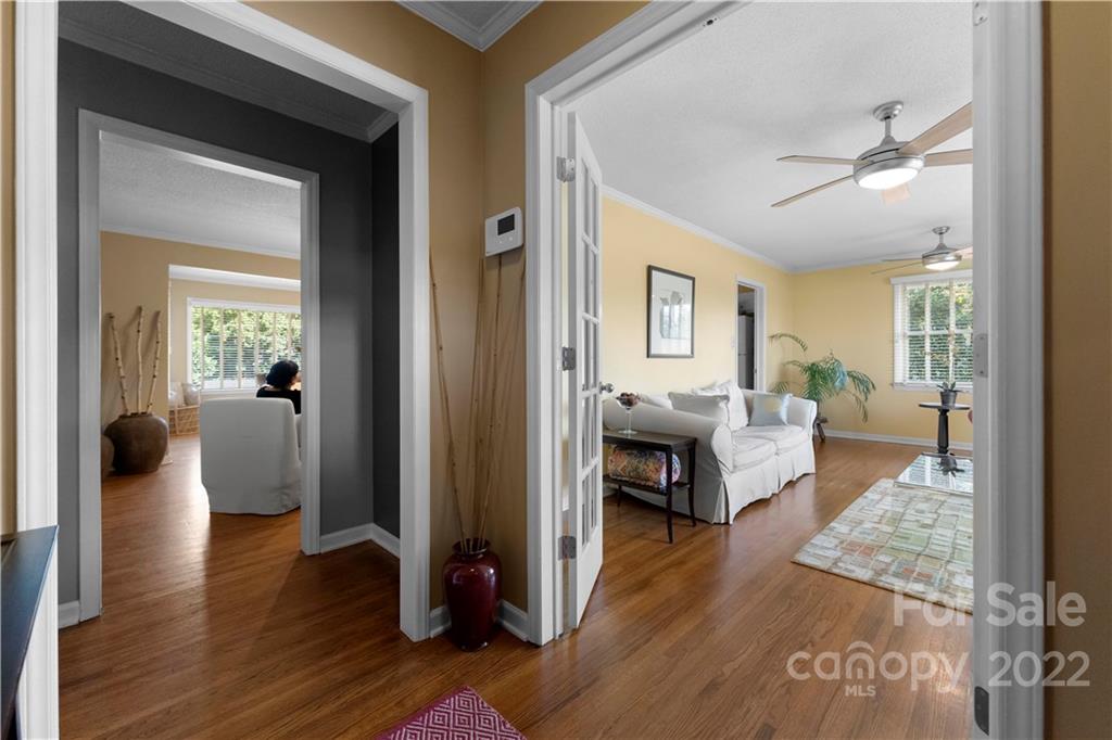 1705 Tyvola Road Charlotte, NC 28210 - Photo 27 of 40 a living room with furniture and a wooden floor