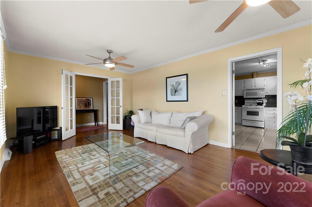 1705 Tyvola Road Charlotte, NC 28210 - Photo 30 of 40 a living room with furniture and a flat screen tv